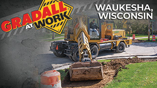 Wheeled Excavator with Multiple Attachments Makes Quick Work of Sidewalk and Curb Removal